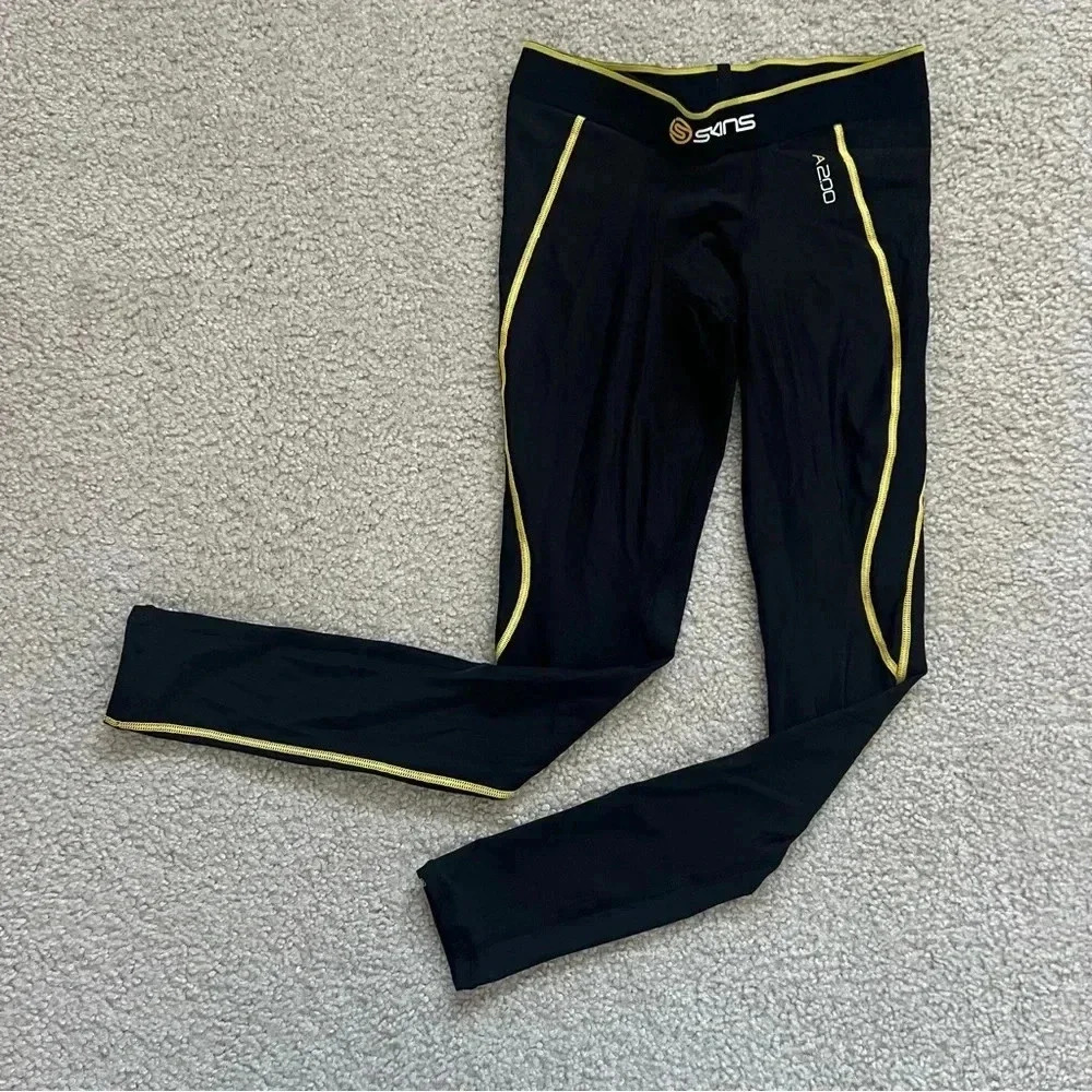 SKINS Men’s Black Performance Compression Pants with Yellow Trim